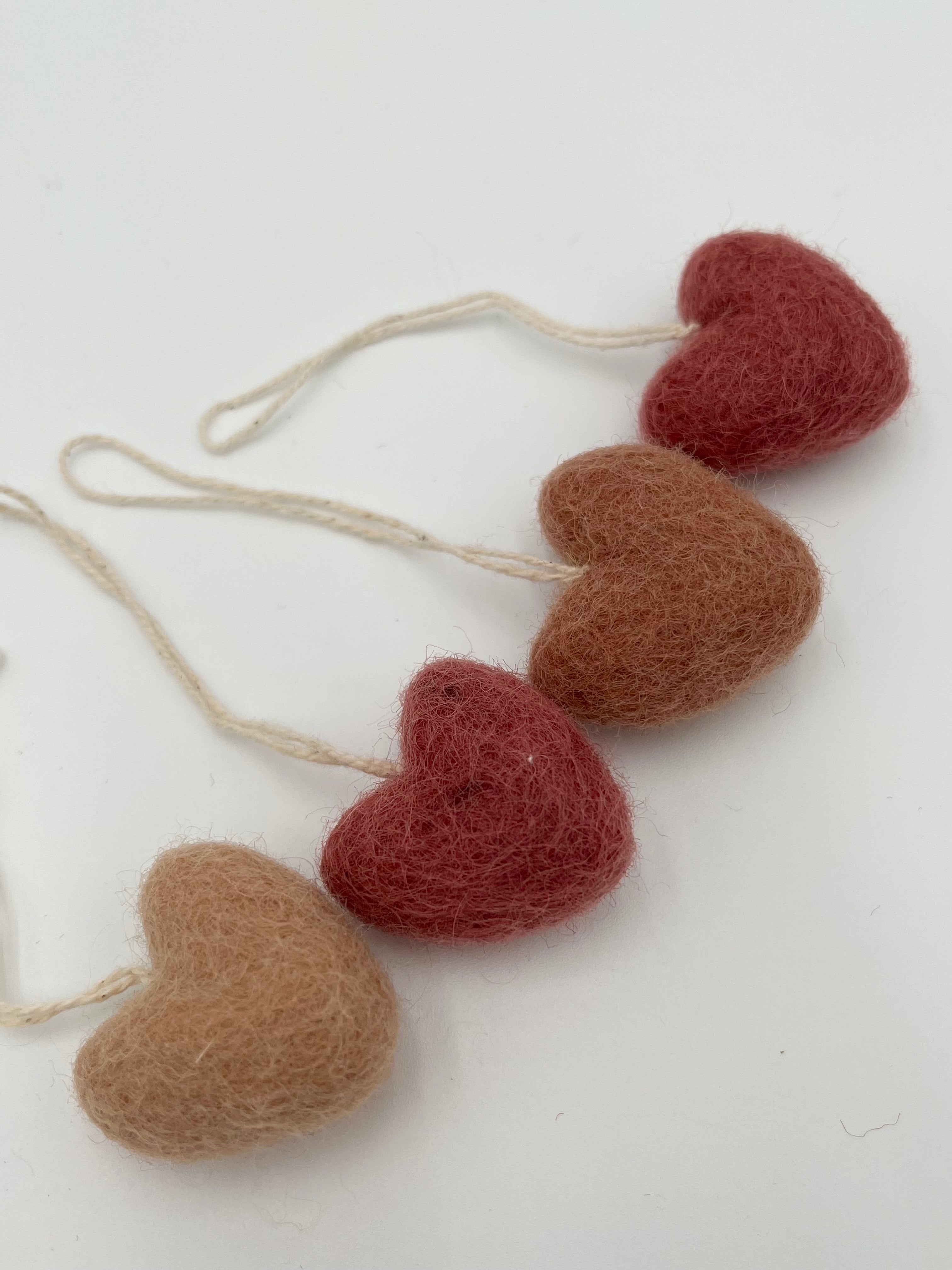 Mini felted hearts on a string