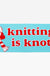 Knitting is Knotty sticker with girl in striped scarf and hat.